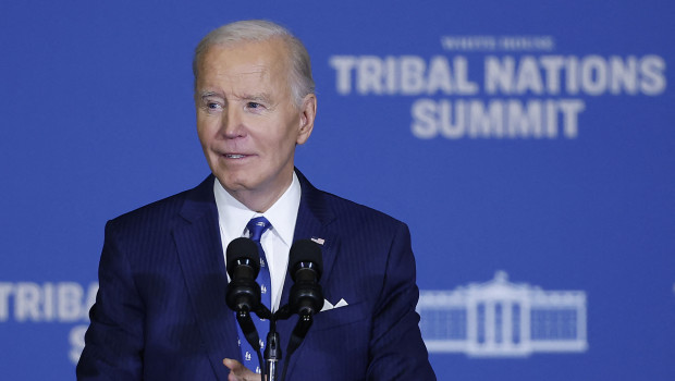 WASHINGTON, DC - DECEMBER 09: U.S. President Joe Biden delivers remarks during the 2024 Tribal Nations Summit at the Interior Department on December 09, 2024 in Washington, DC. The Summit brings together federal officials and Tribal Nation leaders to discuss issues facing Tribal Nations, including Tribal sovereignty, native health and safety programs, and preservation of ancestral lands and waterways. At the summit President Joe Biden will designate a new national monument, The Carlisle Federal Indian Boarding School National Monument located in Carlisle, Pennsylvania, a former facility for reeducating tribal children.   Kevin Dietsch/Getty Images/AFP (Photo by Kevin Dietsch / GETTY IMAGES NORTH AMERICA / Getty Images via AFP)