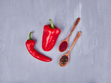 Red hot chilies with paprika and pepper in wooden spoons. High quality photo
