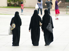 Kuala Lumpur, Malaysia - November 26, 2010: Local women dressed in a religious burka