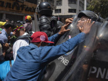 Opponents of interim President Delcy Rodriguez's government clash with police during a demonstration calling for higher wages and pensions in Caracas, Venezuela, on April 9, 2026. (Photo by Jonathan Lanza/NurPhoto) (Photo by Jonathan Lanza / NurPhoto via AFP)