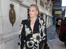 Sharon Stone walking in a black floral gown on a city sidewalk during arriving at the Elle Style Awards in Madrid, Spain, on Tuesday, 2 June 2026.