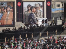 Islamic Revolutionary Guard Corps (IRGC) personnel monitor the area as mourners participate in a farewell ceremony for the bodies of Iran's Supreme Leader Ayatollah Ali Khamenei and his family at the Imam Khomeini Grand Mosque on the eve of his funeral in Tehran, Iran, on July 4, 2026. (Photo by Morteza Nikoubazl/NurPhoto) (Photo by Morteza Nikoubazl / NurPhoto via AFP)