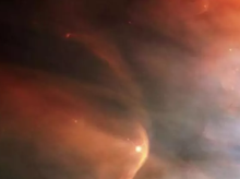 Imagen infrarroja de la onda de choque creada por la enorme estrella gigante Zeta Ophiuchi en una nube de polvo interestelar