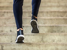 sportsman running up on stairs. Morning workout. Urban scene. Fitness, sport, recreation, workout, healthy lifestyle concepts.