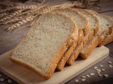 Whole wheat bread on wooden plate