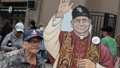 CHICAGO, ILLINOIS - JUNE 14: Graciela Beruben Stan poses with a cutout of Pope Leo XIV as she arrives at Rate Field, home to the Chicago White Sox, for a celebration and mass to honor the election of Pope Leo XIV on June 14, 2025 in Chicago, Illinois. Born Robert Prevost in Chicago and raised in nearby south suburban Dolton, Pope Leo XIV is the first American leader of the Catholic Church. He is also a Chicago White Sox baseball fan.   Scott Olson/Getty Images/AFP (Photo by SCOTT OLSON / GETTY IMAGES NORTH AMERICA / Getty Images via AFP)