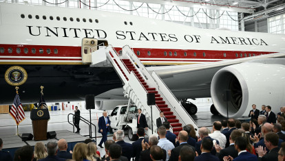 US President Donald Trump speaks in front of the new Air Force One, gifted to him by by Qatar, in a hangar at Joint Base Andrews in Maryland on June 19, 2026. White House officials bade farewell on June 18, 2026 to one of the two jets that have been used to transport US presidents for more than 30 years. The goodbye messages fueled speculation that a Boeing 747 controversially gifted to President Donald Trump by the Gulf emirate of Qatar is now due to enter service. Trump will be heading to Joint Base Andrews before spending the weekend at Camp David. (Photo by Brendan SMIALOWSKI / AFP)