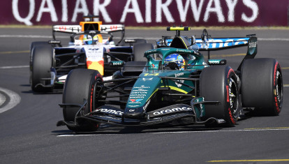 Aston Martin's Spanish driver Fernando Alonso competes ahead of Racing Bulls' British driver Arvid Lindblad during the Formula One Hungarian Grand Prix at the Hungaroring racetrack in Mogyorod near Budapest, Hungary, on July 26, 2026. (Photo by Ferenc ISZA / AFP)