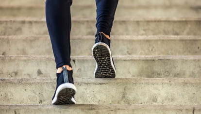 sportsman running up on stairs. Morning workout. Urban scene. Fitness, sport, recreation, workout, healthy lifestyle concepts.