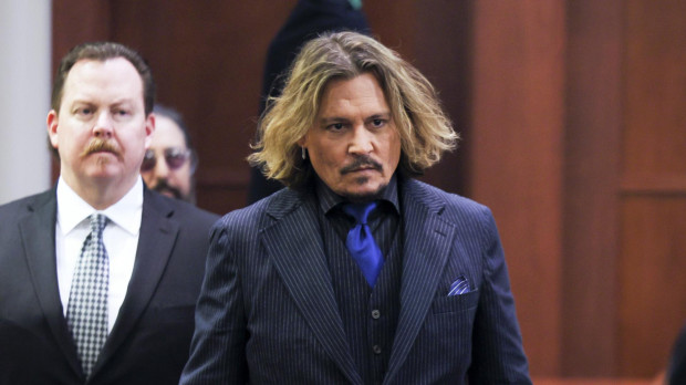 Actor Johnny Depp appears in the courtroom at the Fairfax County Circuit Courthouse during a trial in Fairfax, Va., Wednesday, April 13, 2022.
