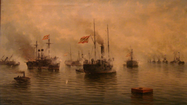 El lienzo representa la batalla de Cavite, que se libró en 1898 durante la Guerra hispanoamericana y supuso una enorme derrota para España, ya que casi toda la flota española resultó aniquilada
