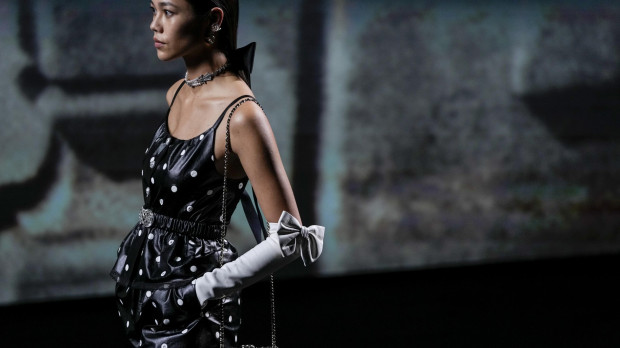 A model wears a creation for the Chanel ready-to-wear Spring/Summer 2023 fashion collection presented Tuesday, Oct. 4, 2022 in Paris. *** Local Caption *** .