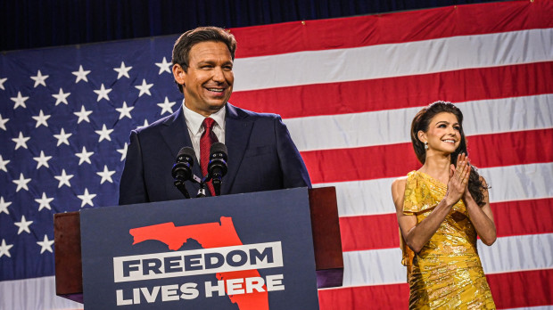 Republican gubernatorial candidate for Florida Ron DeSantis with his wife Casey DeSantis speaks to supporters during an election night watch party at the Convention Center in Tampa, Florida, on November 8, 2022. - Florida Governor Ron DeSantis, who has been tipped as a possible 2024 presidential candidate, was projected as one of the early winners of the night in Tuesday's midterm election. (Photo by Giorgio VIERA / AFP)