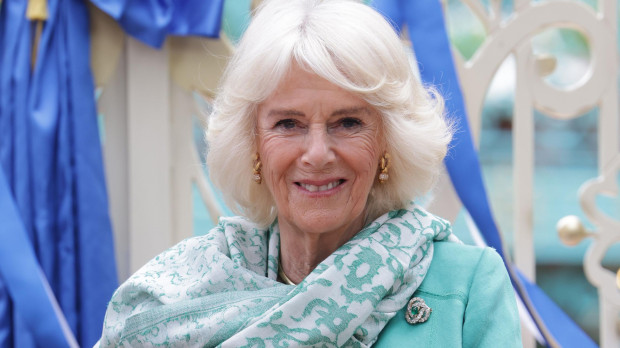 Queen Camilla walk as they attend the opening of the new Coronation Garden in Newtownabbey, Northern Ireland, May 24, 2023.