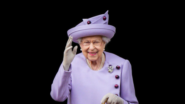 Queen Elizabeth II waves during an Armed Forces Act of Loyalty Parade in Edinburgh, UK, 28 June 2022.