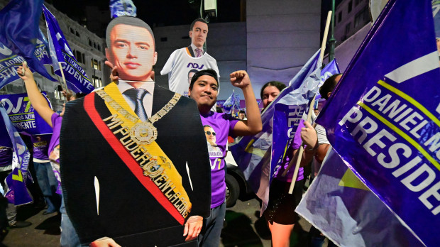 Supporters of Ecuador's President and presidential candidate Daniel Noboa celebrate after learning the first results of the presidential runoff election at the Simon Bolivar Avenue in Guayaquil, Ecuador on April 13, 2025. Ecuador's election authority declared incumbent Daniel Noboa the winner of the presidential runoff vote, after the 37-year-old leader defeated his leftist rival Luisa Gonzalez by a bigger-than-expected margin. (Photo by MARCOS PIN / AFP)