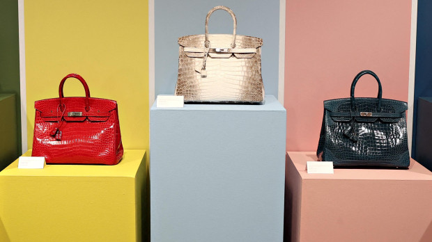 (FILES) This photograph shows Hermes Birkin bags on display during a press preview of the Luxury Week at Christie's, in New York City on June 4, 2021. Auction house Sotheby's said on June 5, 2025, that the first Birkin bag that was designed by French luxury brand Hermes for actress Jane Birkin in 1984, will be auctioned in Paris on July 10, 2025. (Photo by Cindy Ord / GETTY IMAGES NORTH AMERICA / AFP)