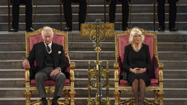 Britain's King Charles III, left, and the Queen Consort sit at Westminster Hall, where both Houses of Parliament are meeting to express their condolences following the death of Queen Elizabeth II, at Westminster Hall, in London, Monday, Sept. 12, 2022. Queen Elizabeth II, Britain's longest-reigning monarch, died Thursday after 70 years on the throne. (Stefan Rousseau/Pool Photo via AP) *** Local Caption *** .