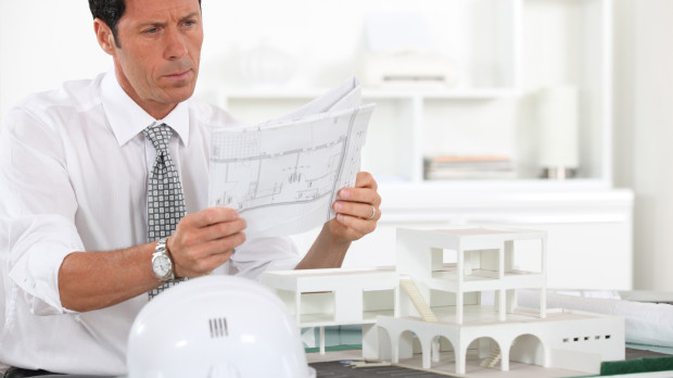 .office,job,model,design,project,concept,plan,draft,portrait,blank,european,caucasian,look,glancing,see,view,looking,peeking,looking at,work,factory,business dealings,deal,business transaction,business,bussiness,labor,profession,occupation,concentrated,real estate,helmet,plans,serious,smart,professional,architect,possession,holding,put,sitting,sit,elegant,building,table,man,construction,tie,promoter,realtor,3539 years
