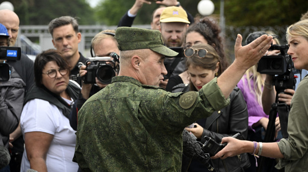 Leonid Kasinsky, an adviser to the Belarus Defence Minister, speaks to the media near a tent camp site that, according to Belarusian Defence Ministry officials, could be offered as one of the spots to house Wagner fighters, in the military settlement of Tsel in the Asipovichy District of the Mogilev Region in Belarus on July 7, 2023. (Photo by Alexander NEMENOV / AFP)