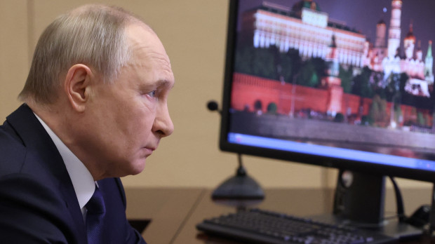 In this pool photograph distributed by Russian state agency Sputnik, Russia's President Vladimir Putin attends a meeting with Chief of the General Staff of the Russian Armed Forces via videoconference at the Novo-Ogaryovo state residence outside Moscow on April 26, 2025. (Photo by Alexander KAZAKOV / POOL / AFP)