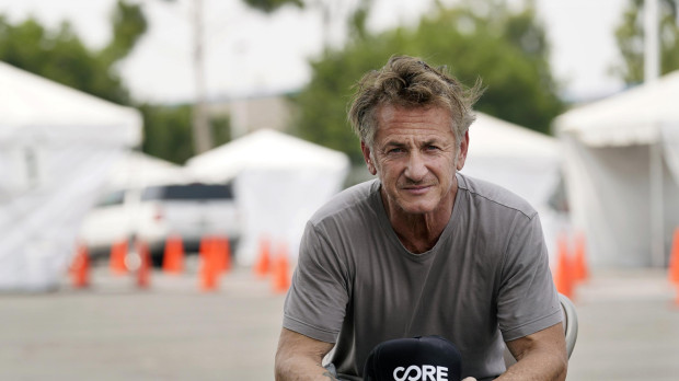 Actor Sean Penn, founder of Community Organized Relief Effort (CORE), is interviewed at a CORE coronavirus testing site at Crenshaw Christian Center, Friday, Aug. 21, 2020, in Los Angeles.