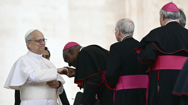 Pope Leo XIV greets bishops at the end of his first weekly general audience at St Peter's Square in The Vatican on May 21, 2025. (Photo by Filippo MONTEFORTE / AFP)