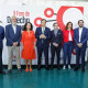 La presidenta del Tribunal Superior de Justicia de Extremadura (TSJM), de rojo en el centro de la imagen y el presidente de la Diputación de Badajoz, a su derecha