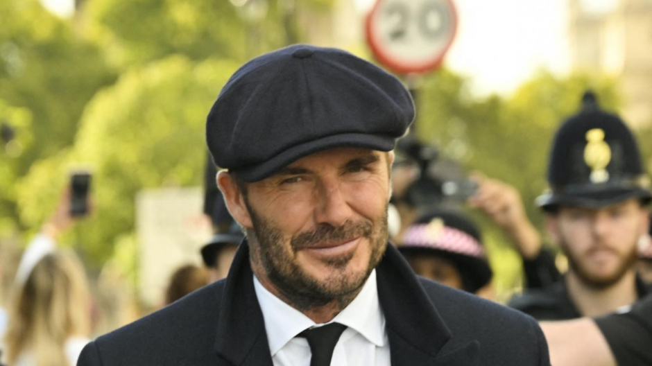 English former football player David Beckham leaves Westminster Hall, at the Palace of Westminster, in London on September 16, 2022 after paying his respects to the coffin of Queen Elizabeth II as it Lies in State. - Queen Elizabeth II will lie in state in Westminster Hall inside the Palace of Westminster, until 0530 GMT on September 19, a few hours before her funeral, with huge queues expected to file past her coffin to pay their respects. (Photo by Louisa Gouliamaki / AFP)