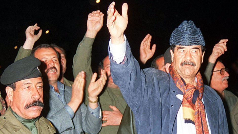 Picture released by INA shows Iraqi President Sadadm Hussein saluting the crowds which gathered to greet him in Nineveh, late 07 March, during his visit to the northern parts of Iraq under government control. Most of the north has been under the control of Kurdish groups in defiance of Baghdad since the aftermath of the 1991 Gulf War. (Photo by STF / INA / AFP)