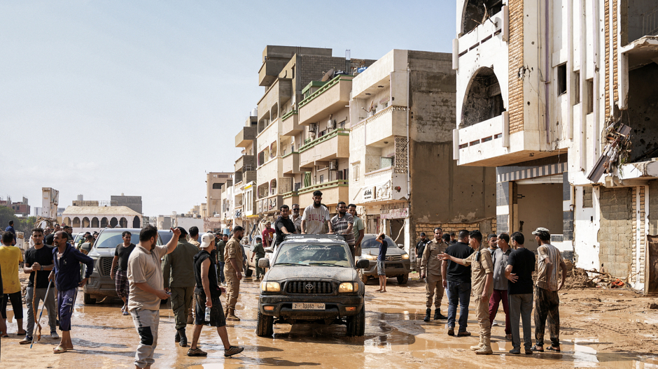 This handout picture provided by the office of Libya's Benghazi-based interim prime minister on September 11, 2023 shows people inspecting damage in a flooded area in the eastern city of Derna, about 290 kilometres east of Benghazi, in the wake of the Mediterranean storm "Daniel". - At least 150 people were killed when freak floods hit eastern Libya, officials said on September 11, after the storm's torrential rains battered Turkey, Bulgaria, and Greece. (Photo by The Press Office of Libyan Prime Minister / AFP) / === RESTRICTED TO EDITORIAL USE - MANDATORY CREDIT "AFP PHOTO / HO /MEDIA OFFICE OF LIBYAN PRIME MINISTER (BENGHAZI)" - NO MARKETING NO ADVERTISING CAMPAIGNS - DISTRIBUTED AS A SERVICE TO CLIENTS === - === RESTRICTED TO EDITORIAL USE - MANDATORY CREDIT "AFP PHOTO / HO /MEDIA OFFICE OF LIBYAN PRIME MINISTER (BENGHAZI)" - NO MARKETING NO ADVERTISING CAMPAIGNS - DISTRIBUTED AS A SERVICE TO CLIENTS === / The erroneous mention[s] appearing in the metadata of this photo by - has been modified in AFP systems in the following manner: [Derna, about 290 kilometres east of Benghazi] instead of [Benghazi]. Please immediately remove the erroneous mention[s] from all your online services and delete it (them) from your servers. If you have been authorized by AFP to distribute it (them) to third parties, please ensure that the same actions are carried out by them. Failure to promptly comply with these instructions will entail liability on your part for any continued or post notification usage. Therefore we thank you very much for all your attention and prompt action. We are sorry for the inconvenience this notification may cause and remain at your disposal for any further information you may require.