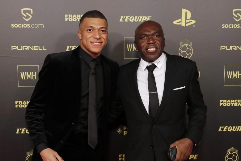 Soccerplayer Kylian Mbappe with his father Wilfried Mbappe during the 65th Ballon d'Or ceremony at Theatre du Chatelet, in Paris, Monday, Nov. 29, 2021