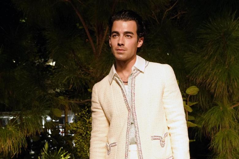 Joe Jonas arrives for an event celebrating 100 years of the fragrance Chanel No. 5 during Miami Art Week, Friday, Dec. 3, 2021, in the Design District neighborhood of Miami. Artist Es Devlin was commissioned by Chanel to create an installation titled "Five Echoes" for the celebration. Miami Art Week is an annual event centered around the Art Basel Miami Beach fair.