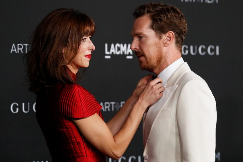 Sophie Hunter adjusts the bowtie on her husband, actor Benedict Cumberbatch at the LACMA Art+Film Gala in Los Angeles, California, U.S. November 6, 2021. REUTERS/Mario Anzuoni *** Local Caption *** .