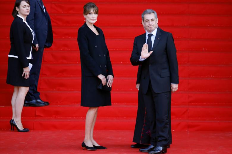 Former French President Nicolas Sarkozy and his wife Carla Bruni attending a military funeral honors ceremony for Jacques Chirac at the HoteldesInvalides during a national day of mourning in Paris, France, September 30, 2019. *** Local Caption *** .