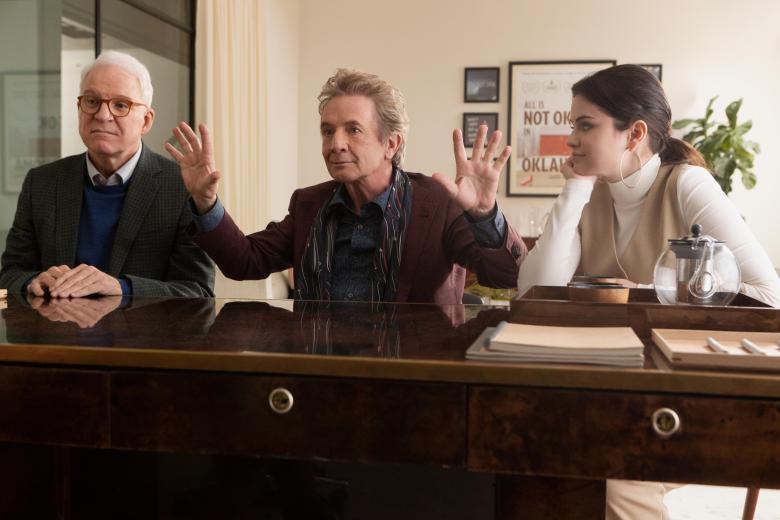 Only Murders In The Building -- "The Sting" - Episode 104 -- Believing the murderer might be a famous resident whom is difficult to access, the group seeks advice from a renowned podcasting host. Charles (Steve Martin), Oliver (Martin Short) and Mabel (Selena Gomez), shown. (Photo by: Craig Blankenhorn/Hulu)