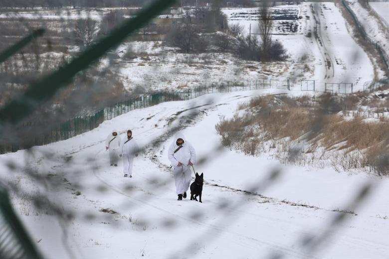 Ukrainian border guards patrol a Ukraine - Russia border not far from Eastern Ukrainian city of Kharkiv, 16 February 2022 amid tensions on the Ukrainian-Russian border