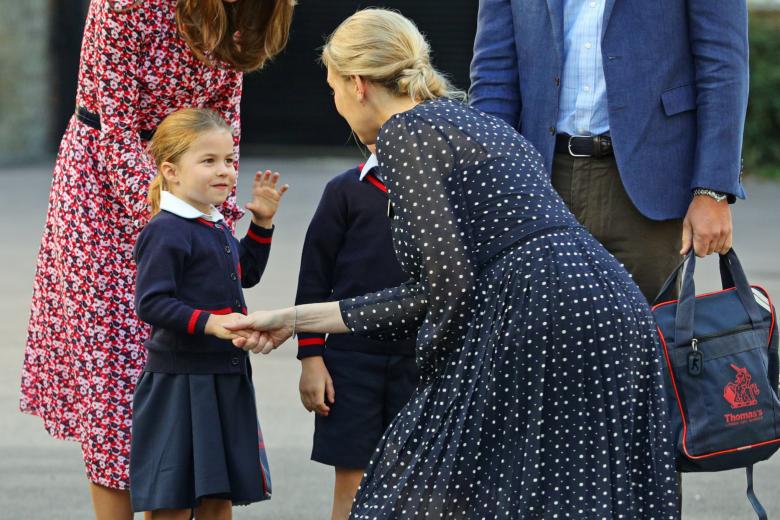Princess Charlotte arrives for her first day at school at Thomas's Battersea in London, with her parents Prince William and Kate Middleton the Duke and Duchess of Cambridge next to Helen Haslem