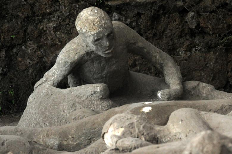 Plaster casts of victims ,overcome by the fury of the eruption while they sought an scape, are on display in the Garden of the Fugitives in Pompeii, south Italy on November 25, 2010.