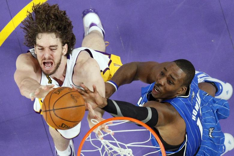 Los Angeles Lakers center Pau Gasol, left, of Spain grabs a rebound from Orlando Magic center Dwight Howard during the second half of Game 2 of the NBA basketball finals, Sunday, June 7, 2009, in Los Angeles.  The Lakers won 101-96.