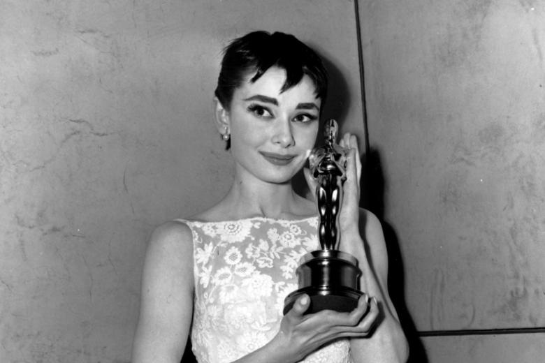 Audrey Hepburn poses with her statuette at the 26th Annual Academy Awards ceremony in New York on March 25, 1954.  Hepburn won for best actress for her portrayal in "Roman Holiday."