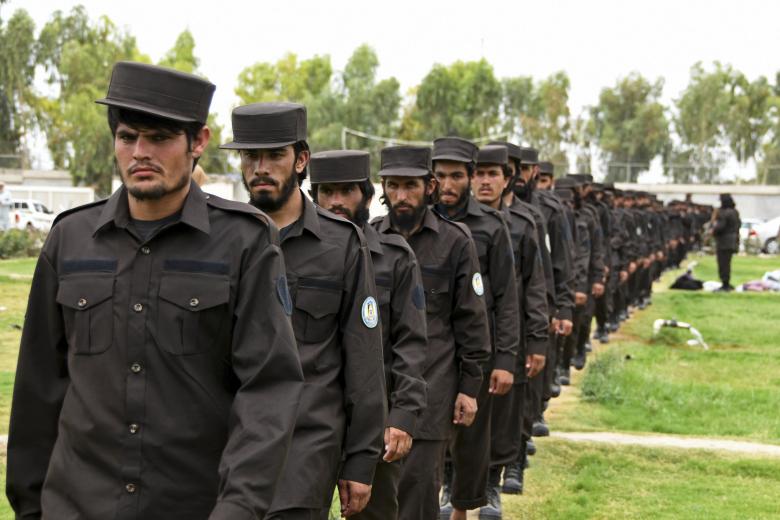 Policemen attend a ceremony organised by the Taliban authorities to hand out their brand new uniforms in Kandahar on July 6, 2022. (Photo by Javed TANVEER / AFP)