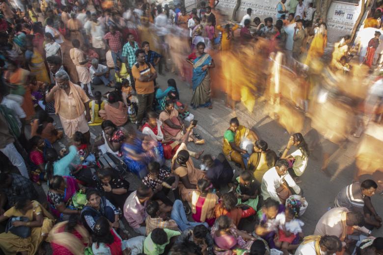 Chennai (India), 29/08/2022.- Christian devotees sit along a road as they arrive to offer prayers during Annai Velankanni (Our Lady of Good Health) festival, at Annai Velankanni Shrine in Chennai, India, 29 August 2022. Annai Velankanni is an annual festival celebrated for 11 days. The festival is dedicated to Mother Mary who is known as Annai Velankanni in Tamil. The feast starts on August 29 and concludes on September 08 and is celebrated in the state of Tamil Nadu. EFE/EPA/Idrees Mohammed