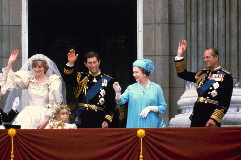 Britain's heir to the throne Prince Charles and his bride Diana Spencer, left, wave next to Queen Elizabeth II and Prince Consort Philip, right, from the balcony of Buckingham Palace in London July 29, 1981.
