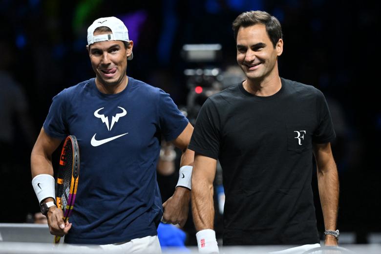 Nadal y Federer preparando su partido de dobles