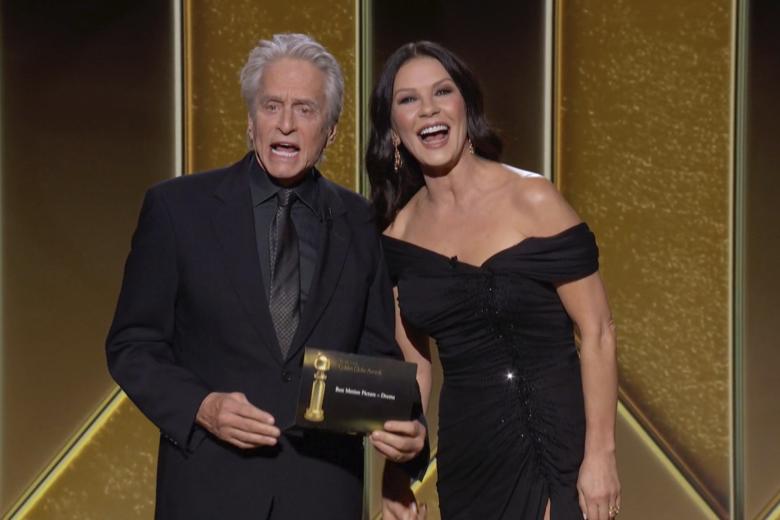 Actors Michael Douglas, left, and Catherine Zeta-Jones present the award for best picture drama at the Golden Globe Awards.