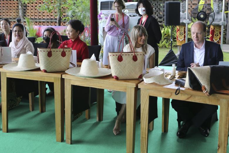 From left to right,  Iriana, wife of President Joko "Jokowi" Widodo,  Peng Liyuan, wife of China's President Xi Jinping,  Maria Begoña Gomez Fernandez, wife of Spain's Prime Minister Pedro Sanchez, and Heiko von der Leyen, husband of European Commission Ursula von der Leyen attend the G20 spouse programs in Nusa Dua, Bali, Indonesia on Tuesday, Nov. 15, 2022. (AP Photo/Firdia Lisnawati, Pool)