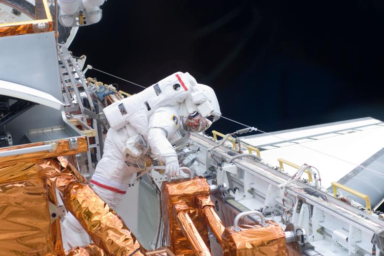 Astronaut Richard Arnold participates in the mission's first scheduled spacewalk to connect the S6 truss segment to the International Space Station Thursday March 19, 2009.