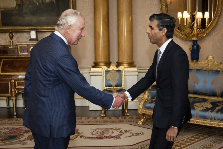 King Charles III welcomes Rishi Sunak during an audience at Buckingham Palace, London, where he invited the newly elected leader of the Conservative Party to become Prime Minister and form a new government, Tuesday, Oct. 25, 2022.  *** Local Caption *** .