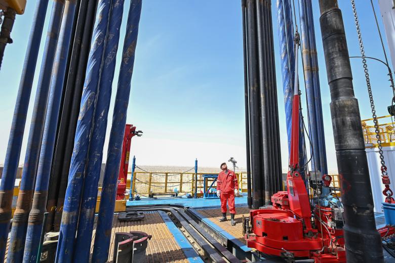 (230530) -- URUMQI, May 30, 2023 (Xinhua) -- An engineer inspects the operation of drilling machine at the drilling project of a borehole over 10,000 meters deep for scientific exploration in northwest China's Xinjiang Uygur Autonomous Region, May 30, 2023.
  The drilling of China's first borehole over 10,000 meters deep for scientific exploration began on Tuesday in the Tarim Basin, northwest China's Xinjiang Uygur Autonomous Region.
   The operation started at 11:46 a.m. on Tuesday. It represents a landmark in China's deep-Earth exploration, providing an unprecedented opportunity to study areas of the planet deep beneath the surface. (Xinhua/Li Xiang) (Photo by Li Xiang / XINHUA / Xinhua via AFP)